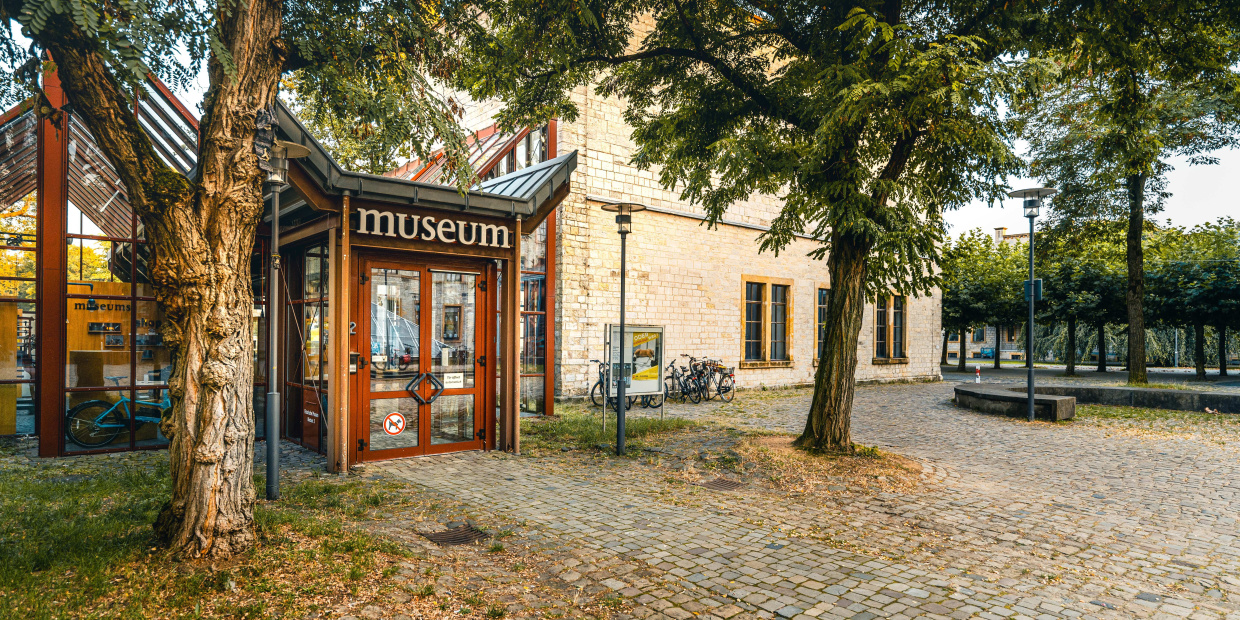 Bielefeld Marketing | Tim Fröhlich Bench Bicycle City Cobblestone Path Road Street Tree Urban Walkway