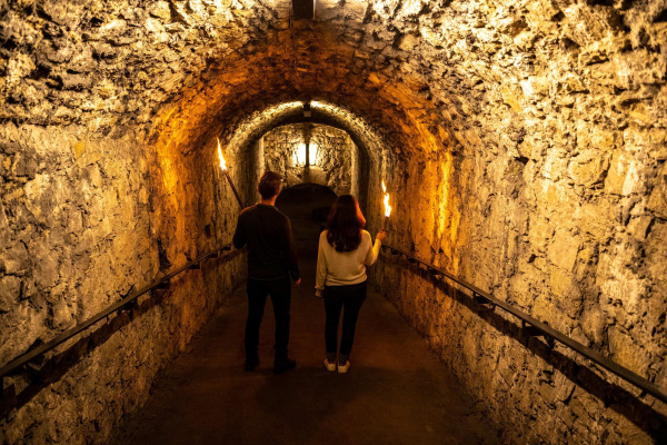 Adult Crypt Female Male Man Person Shoe Tunnel Woman